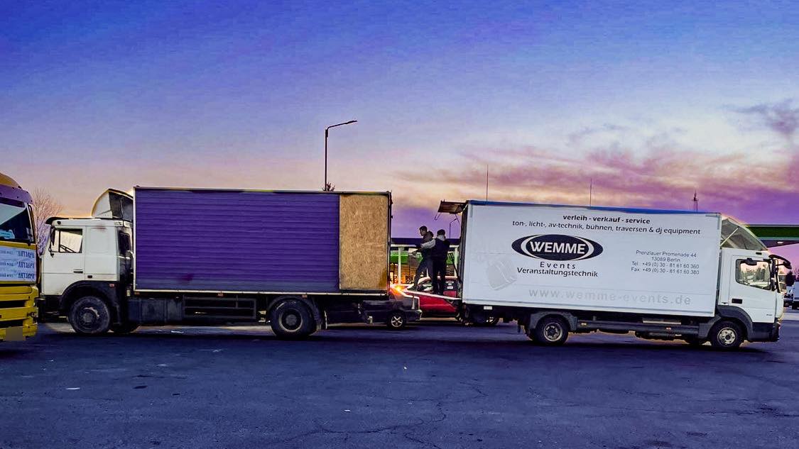  Unloading our 15 pallets of networking equipment onto the waiting DEPs truck for distribution